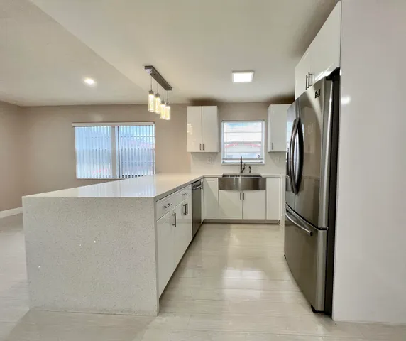 a bathroom with a toilet a sink and a mirror