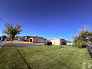 588 North 4500 West West Point, UT 84015 - Photo 60 of 61 Expansive grassy yard with a chain-link fence border
