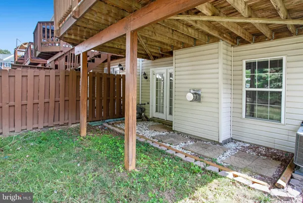 a view of balcony with wooden floor and outdoor seating
