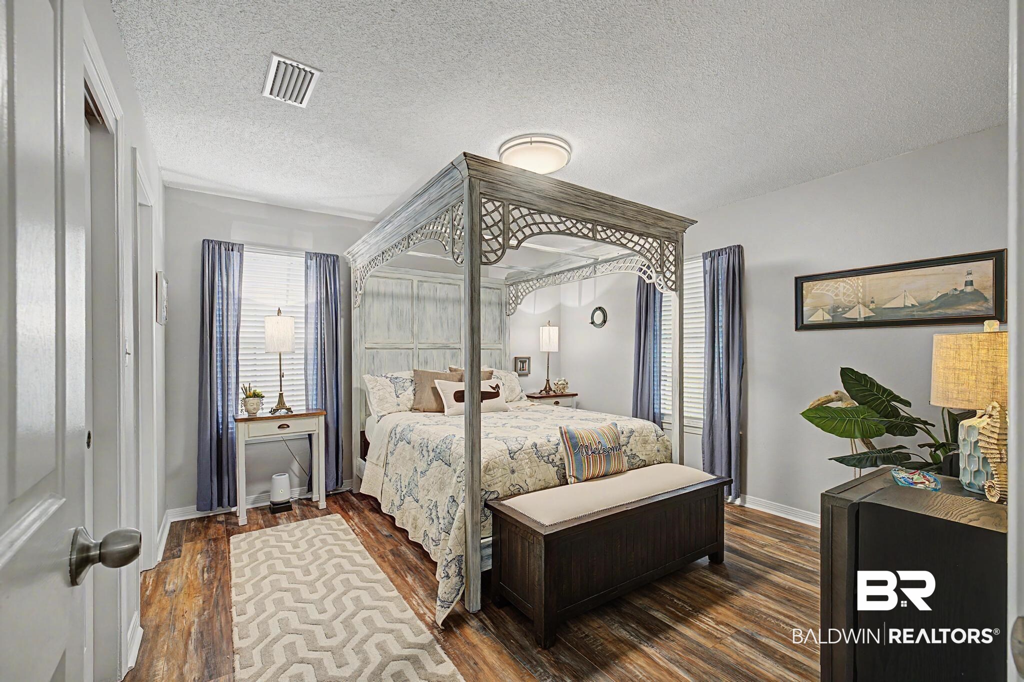 2808 Pine Ridge Drive Lillian, AL 36549 - Photo 21 of 47 Spacious bedroom featuring wood-finish flooring, a ceiling-mounted light fixture, and crown molding