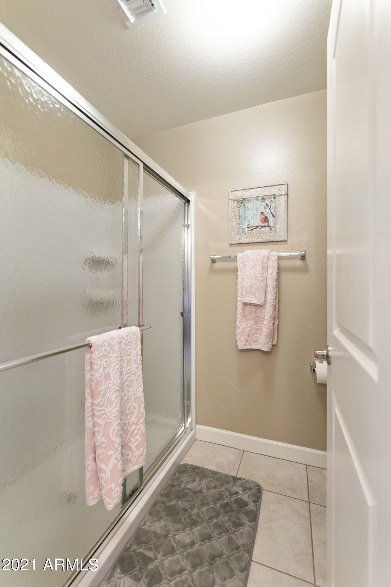 2150 West Alameda Road, Unit 1093 Phoenix, AZ 85085 - Photo 18 of 35 a bathroom with a shower and a sink