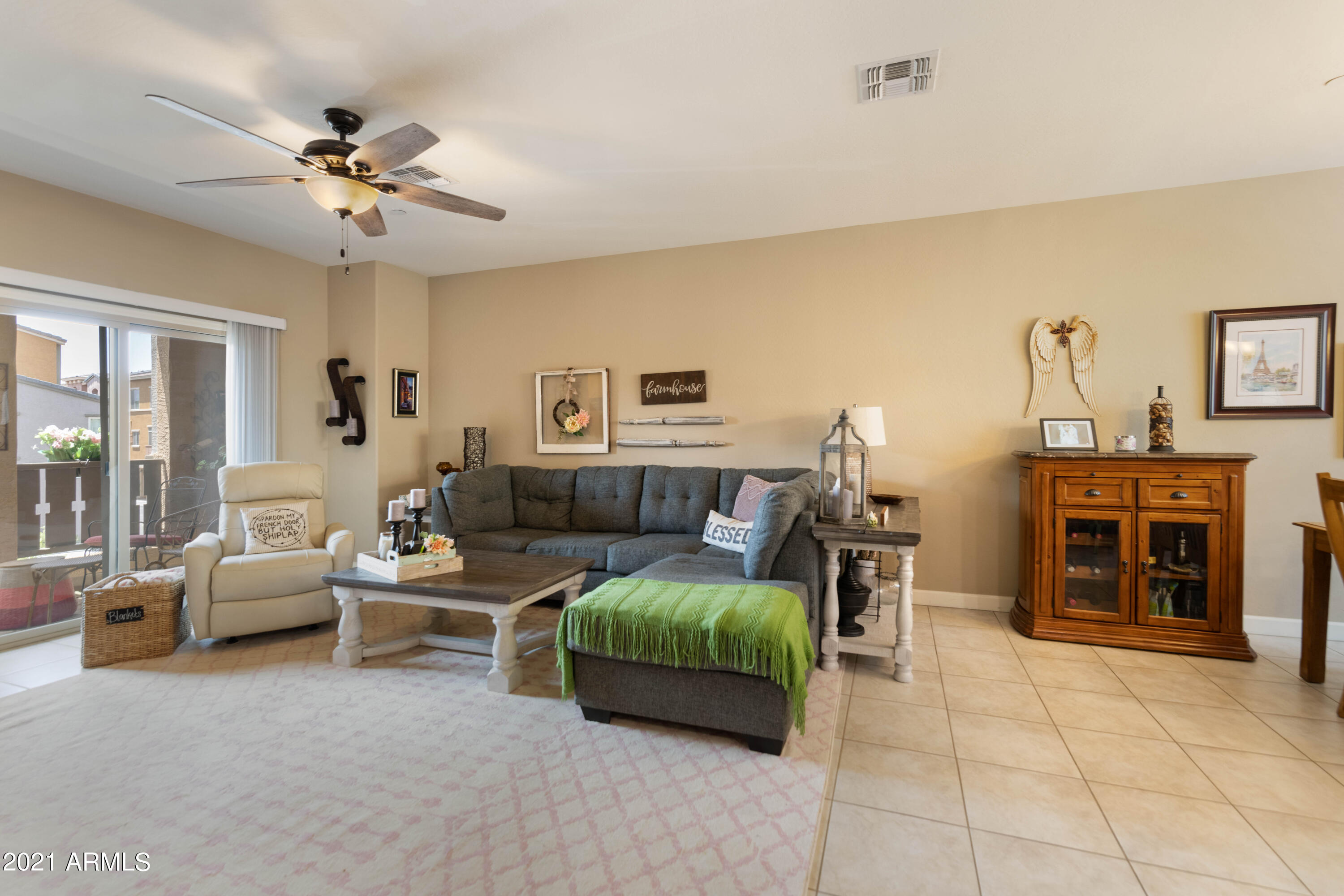 2150 West Alameda Road, Unit 1093 Phoenix, AZ 85085 - Photo 6 of 35 a living room with furniture and a fireplace