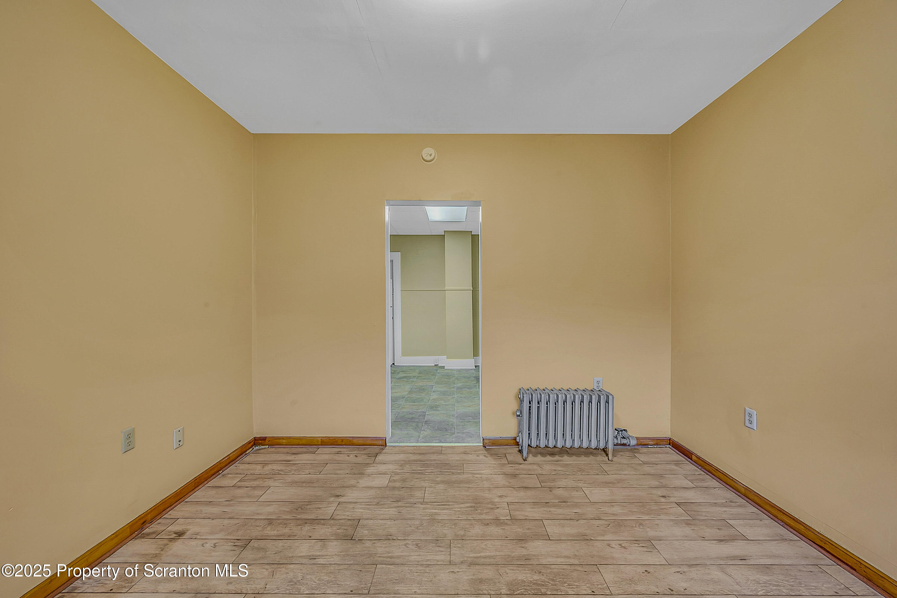 924 Snyder Avenue Scranton, PA 18504 - Photo 15 of 28 a view of an empty room with wooden floor