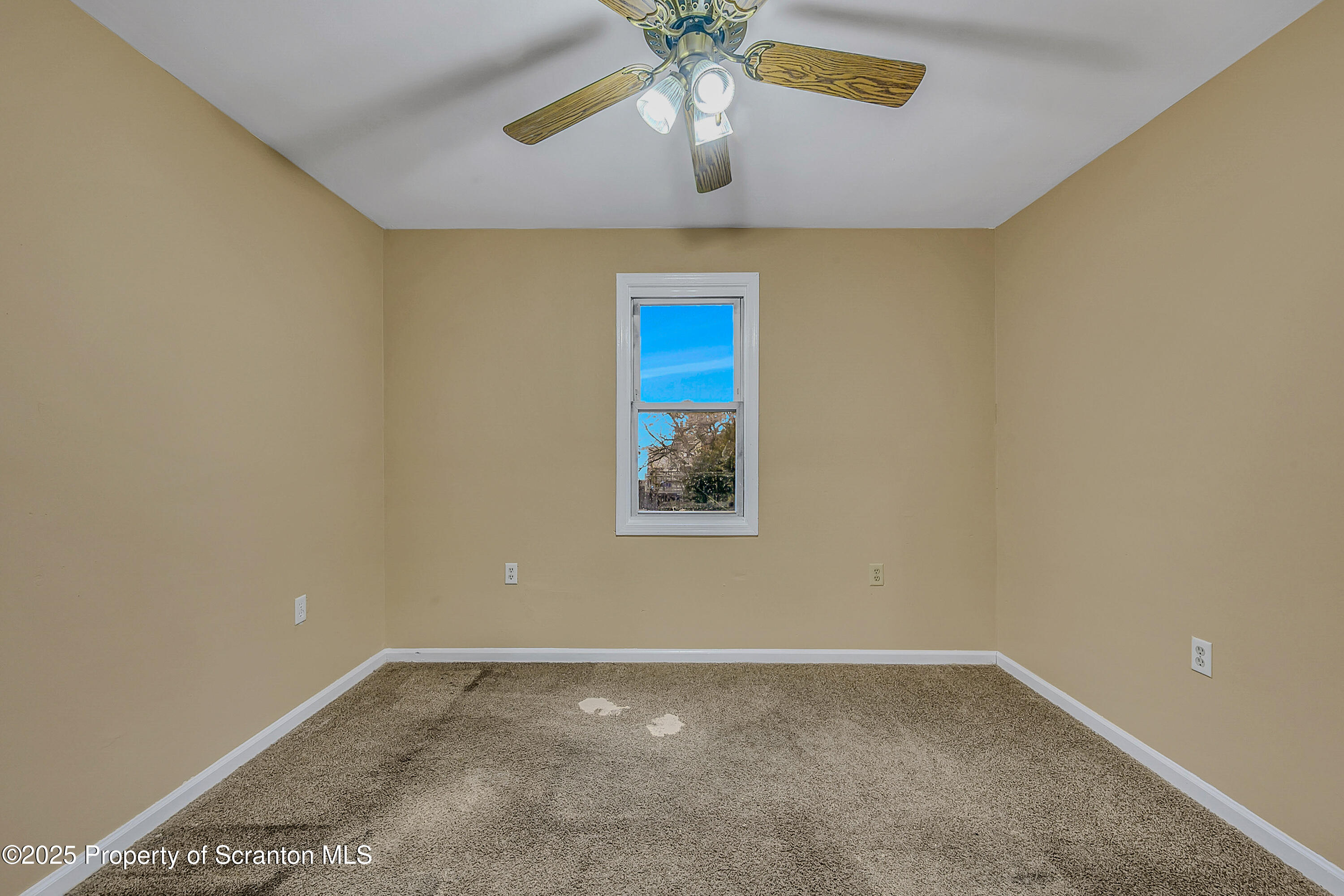 924 Snyder Avenue Scranton, PA 18504 - Photo 22 of 28 a view of room with window and ceiling fan