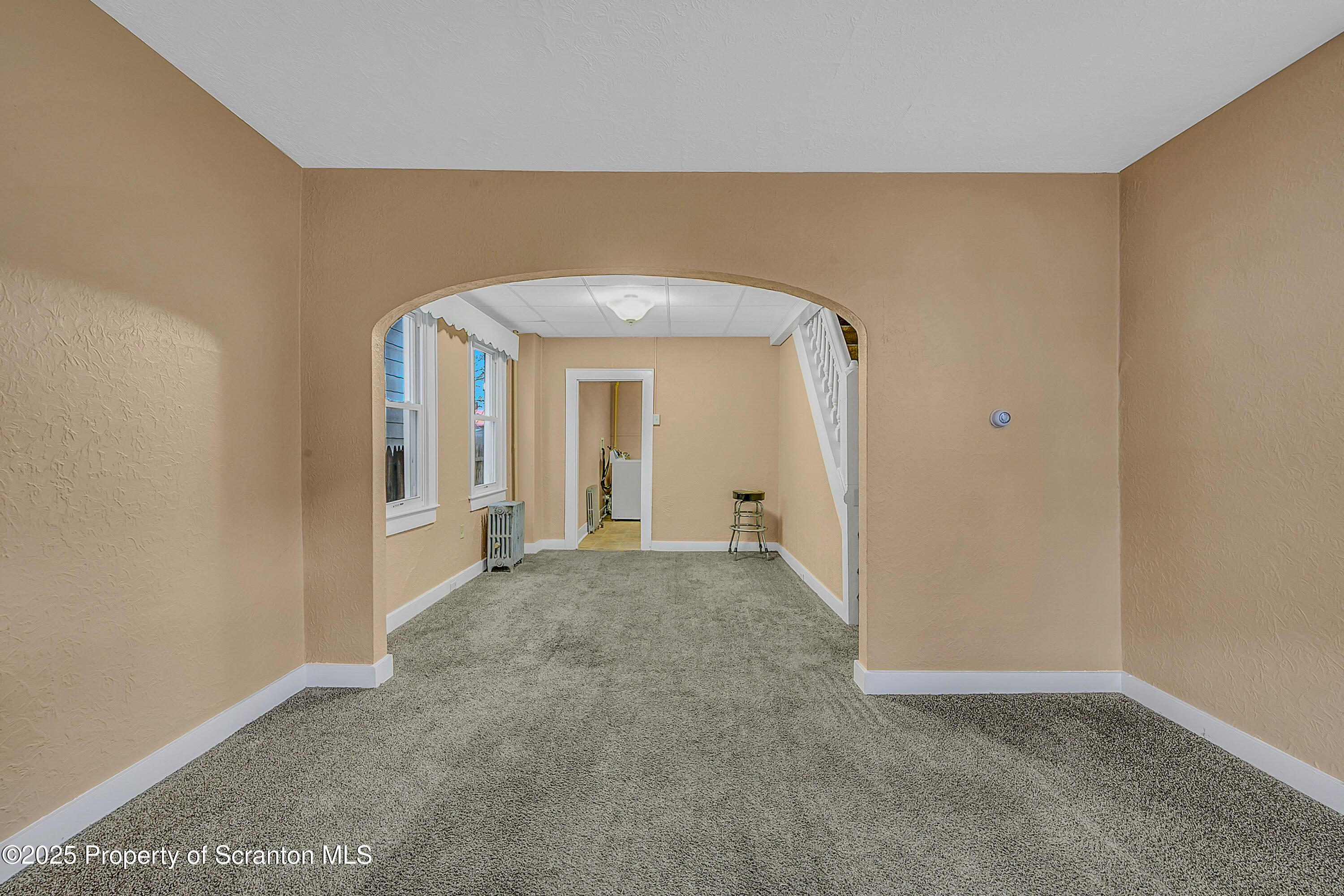 924 Snyder Avenue Scranton, PA 18504 - Photo 7 of 28 a view of a big room with closet and wooden floor