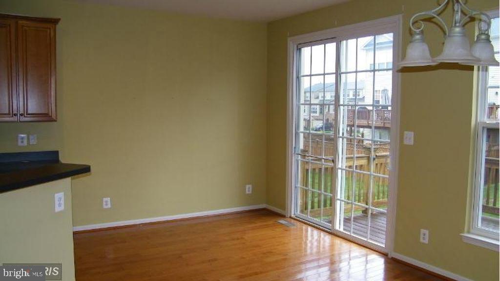 43265 Sunderleigh Square Broadlands, VA 20148 - Photo 11 of 27 a view of an empty room with a window