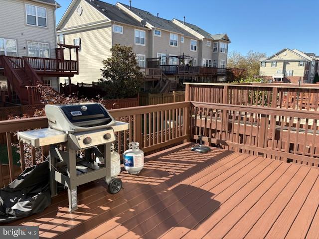 43265 Sunderleigh Square Broadlands, VA 20148 - Photo 15 of 27 a view of a balcony with chairs and wooden floor