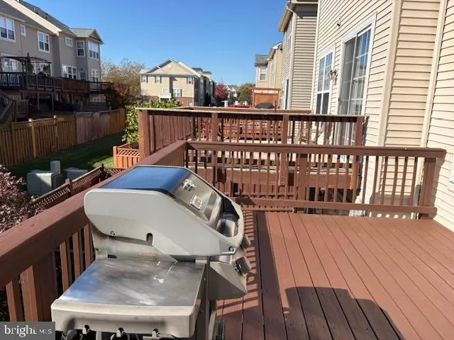 a view of a balcony with a table and chairs