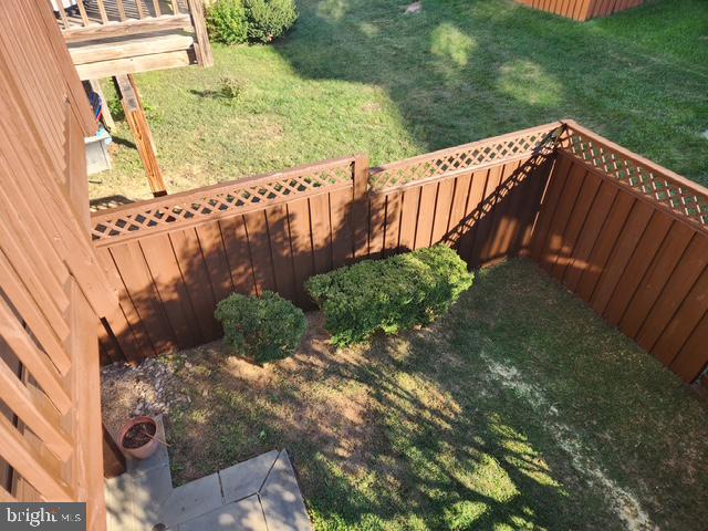 43265 Sunderleigh Square Broadlands, VA 20148 - Photo 17 of 27 a view of a garden with wooden fence