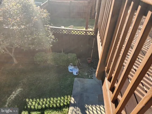 a view of balcony with wooden floor