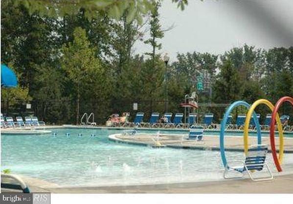 43265 Sunderleigh Square Broadlands, VA 20148 - Photo 26 of 27 a view of a swimming pool with a yard