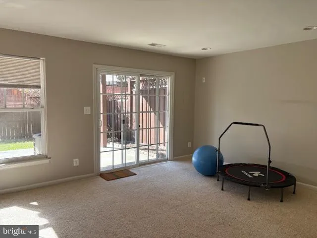 a view of a livingroom with furniture and a window