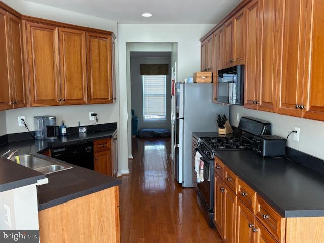 43265 Sunderleigh Square Broadlands, VA 20148 - Photo 6 of 27 a kitchen with granite countertop a sink a stove and refrigerator