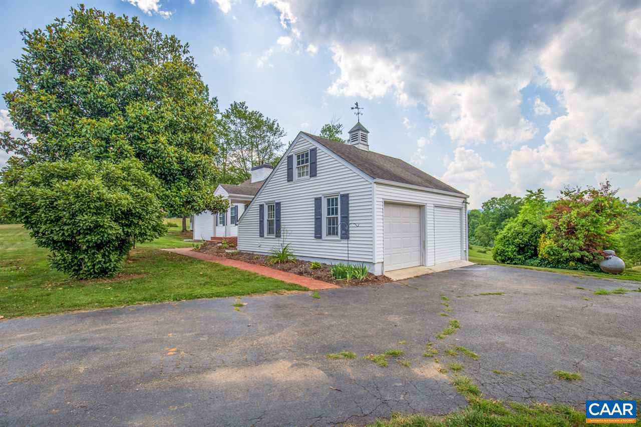 198 Keith Road Stanardsville, VA 22973 - Photo 11 of 49 a front view of a house with a yard and garage