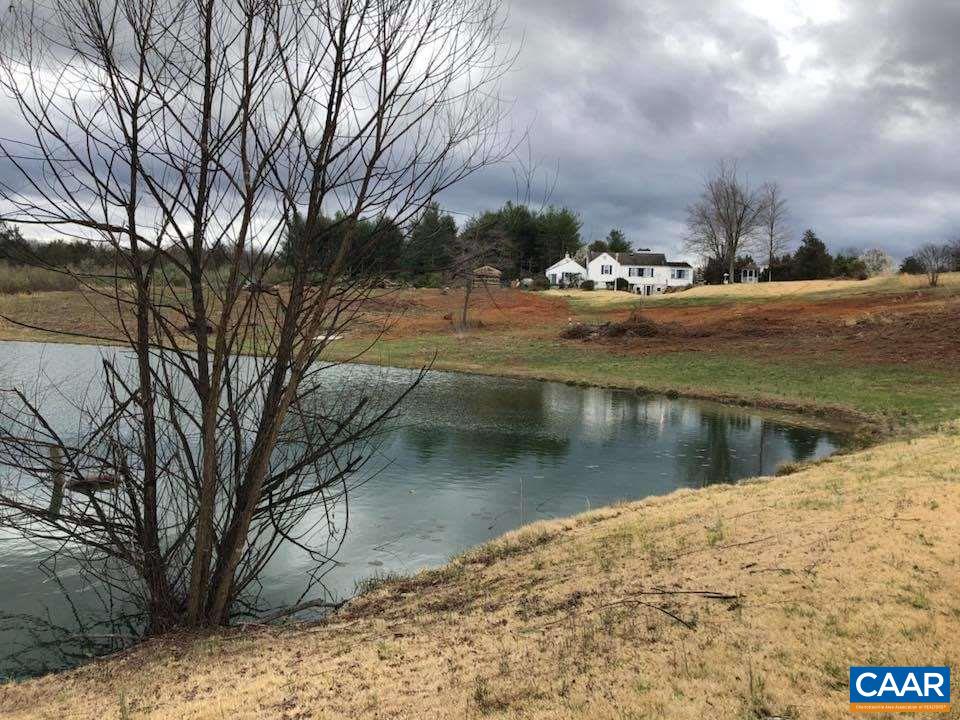 198 Keith Road Stanardsville, VA 22973 - Photo 16 of 49 a view of a lake with a yard