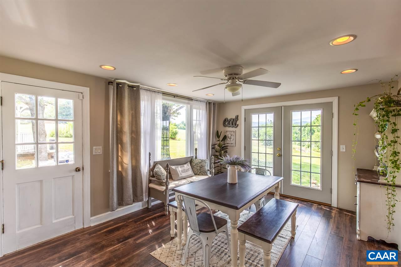 198 Keith Road Stanardsville, VA 22973 - Photo 26 of 49 a view of a dining room with furniture window and wooden floor