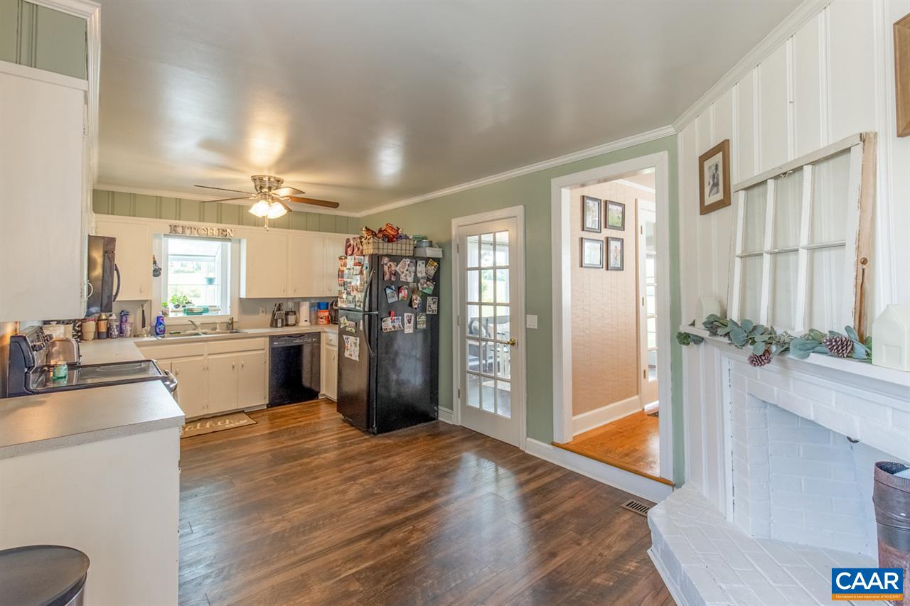 198 Keith Road Stanardsville, VA 22973 - Photo 27 of 49 a kitchen with stainless steel appliances wooden floor and large window