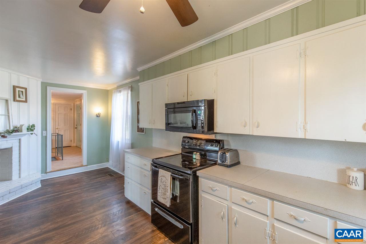 198 Keith Road Stanardsville, VA 22973 - Photo 32 of 49 a kitchen with stainless steel appliances granite countertop a stove a sink and a refrigerator