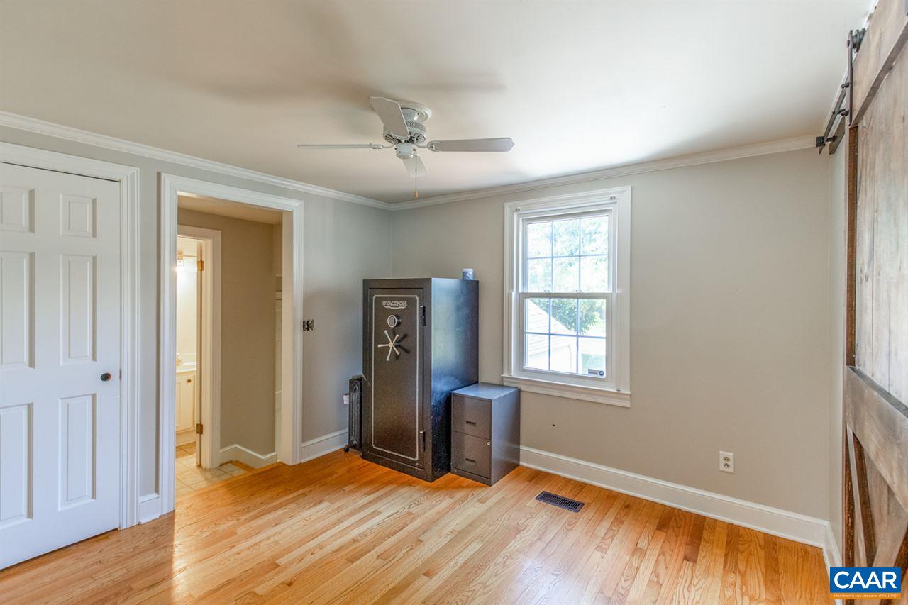 198 Keith Road Stanardsville, VA 22973 - Photo 35 of 49 a view of an empty room with window and wooden floor