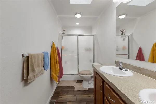 a bathroom with a sink toilet and a shower