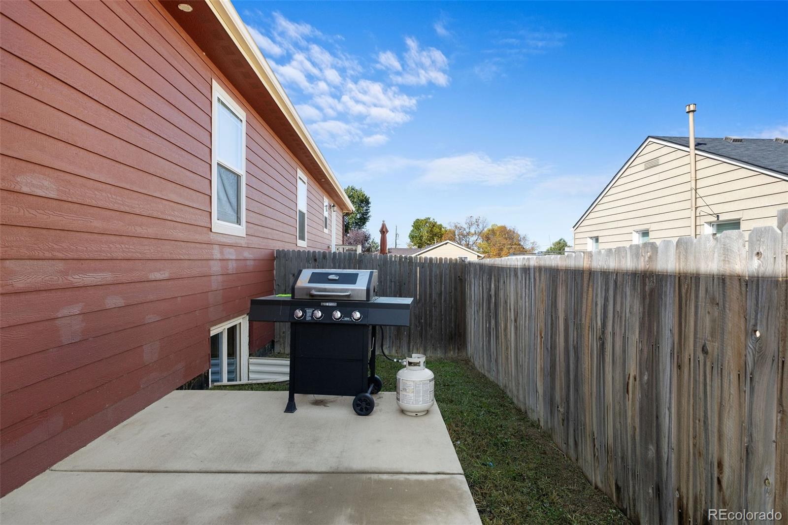 574 4th Street Bennett, CO 80102 - Photo 19 of 21 a view of a patio with a table and chairs