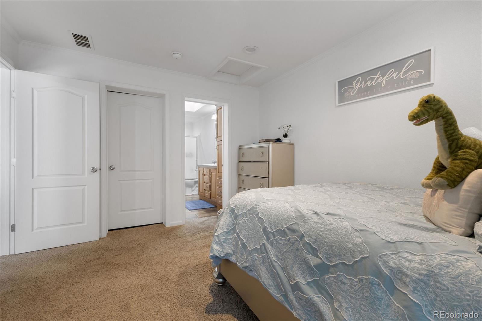 574 4th Street Bennett, CO 80102 - Photo 10 of 21 a bedroom with a bed and hallway