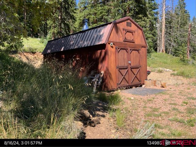 a view of a wooden door with a yard