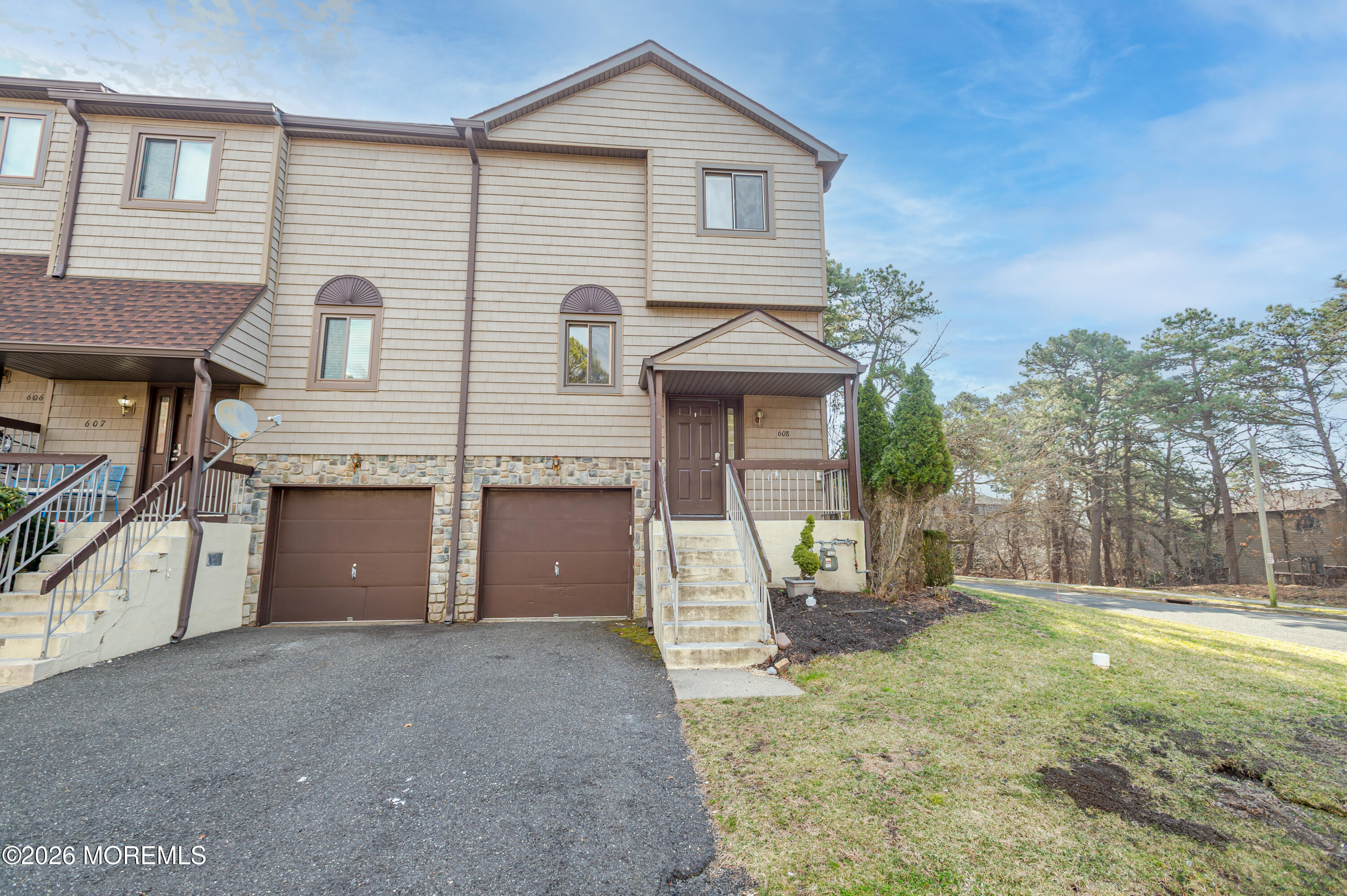 608 Alpine Trail Neptune Township, NJ 07753 - Photo 1 of 27 a front view of a house with garden