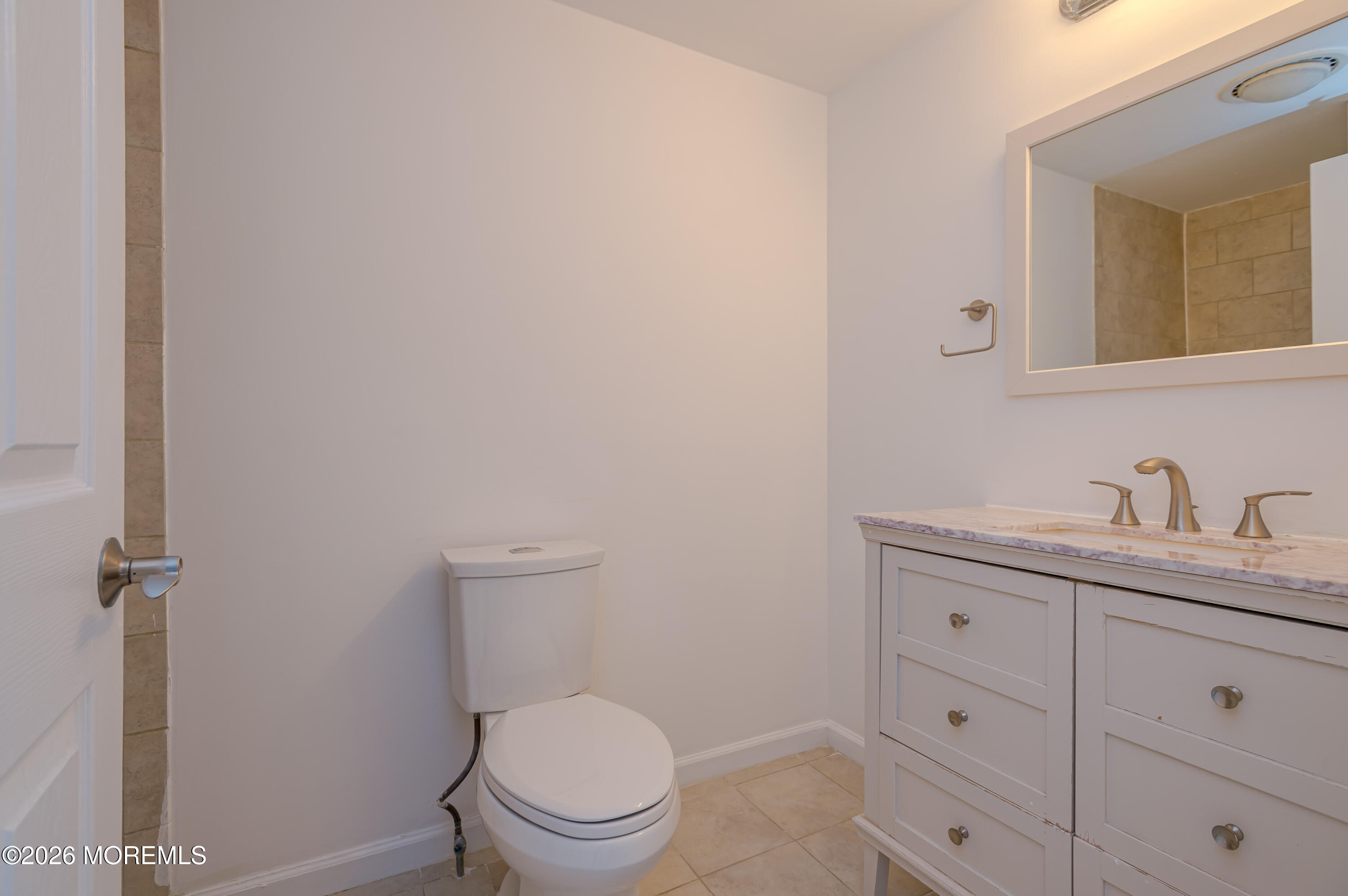 608 Alpine Trail Neptune Township, NJ 07753 - Photo 12 of 27 a bathroom with a granite countertop toilet sink and mirror