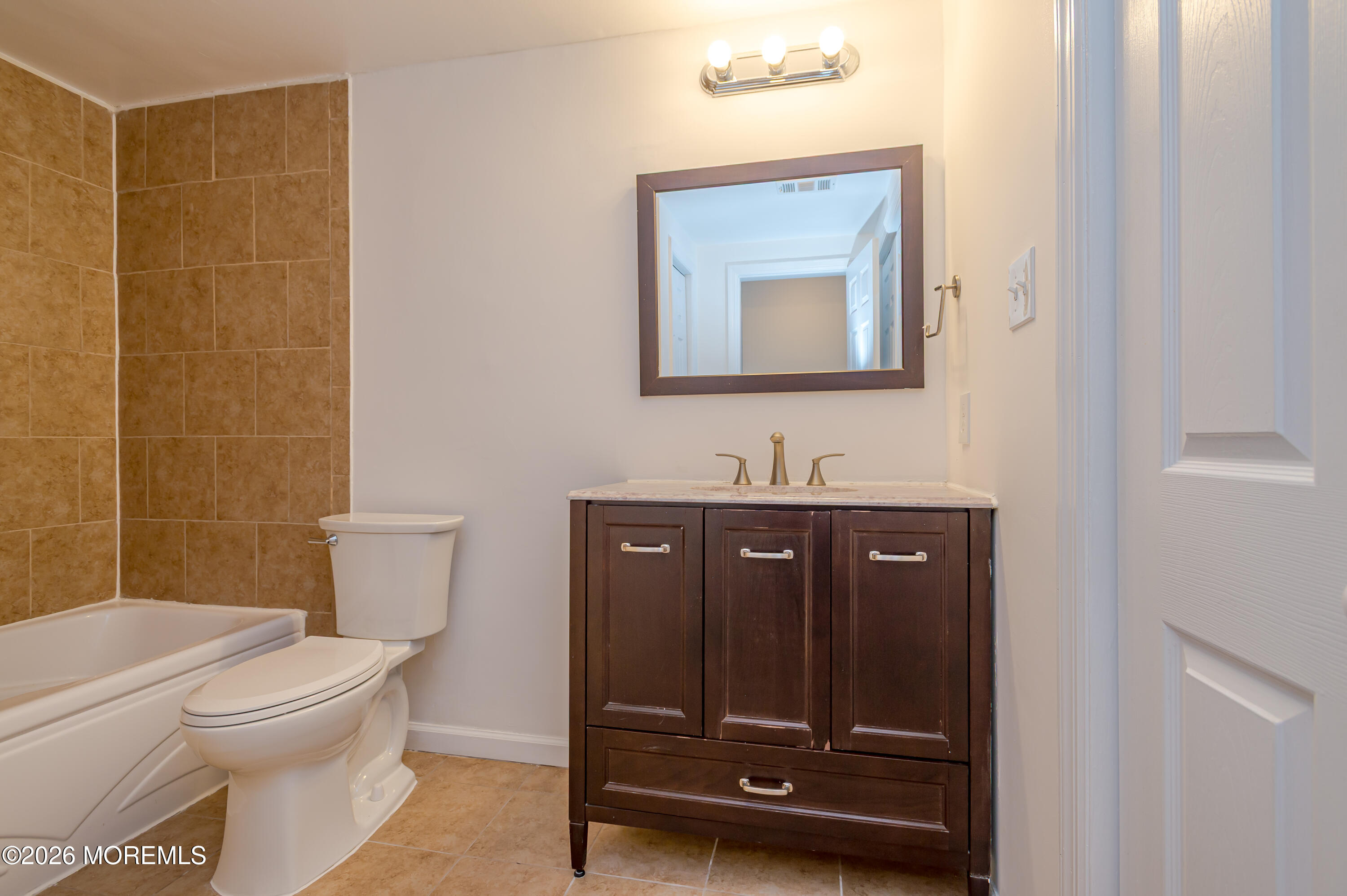 608 Alpine Trail Neptune Township, NJ 07753 - Photo 15 of 27 a bathroom with a toilet a sink and mirror