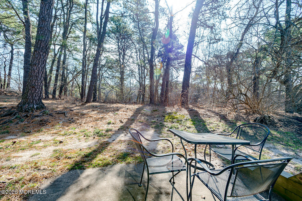 608 Alpine Trail Neptune Township, NJ 07753 - Photo 20 of 27 a view of a chairs and table on the wooden floor