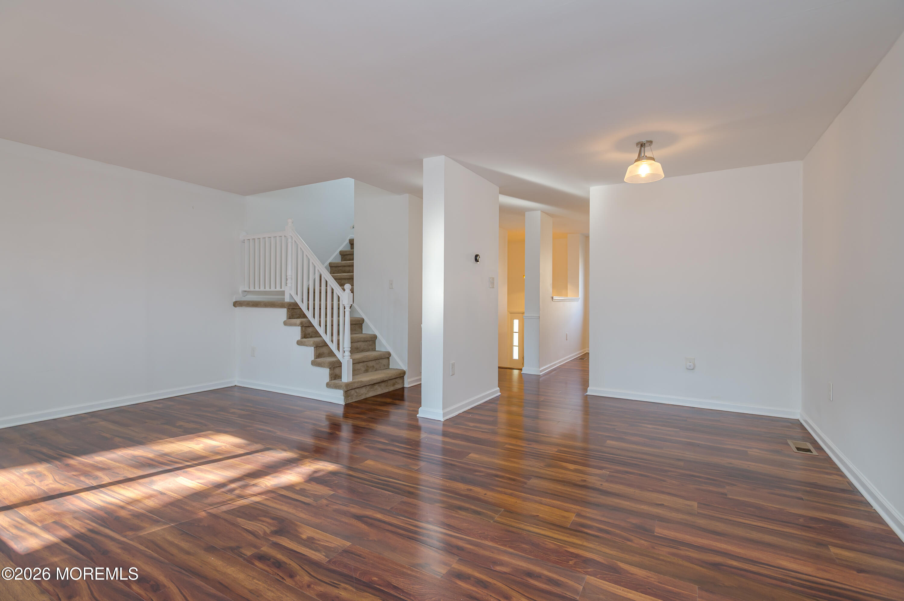 608 Alpine Trail Neptune Township, NJ 07753 - Photo 7 of 27 a view of empty room with wooden floor