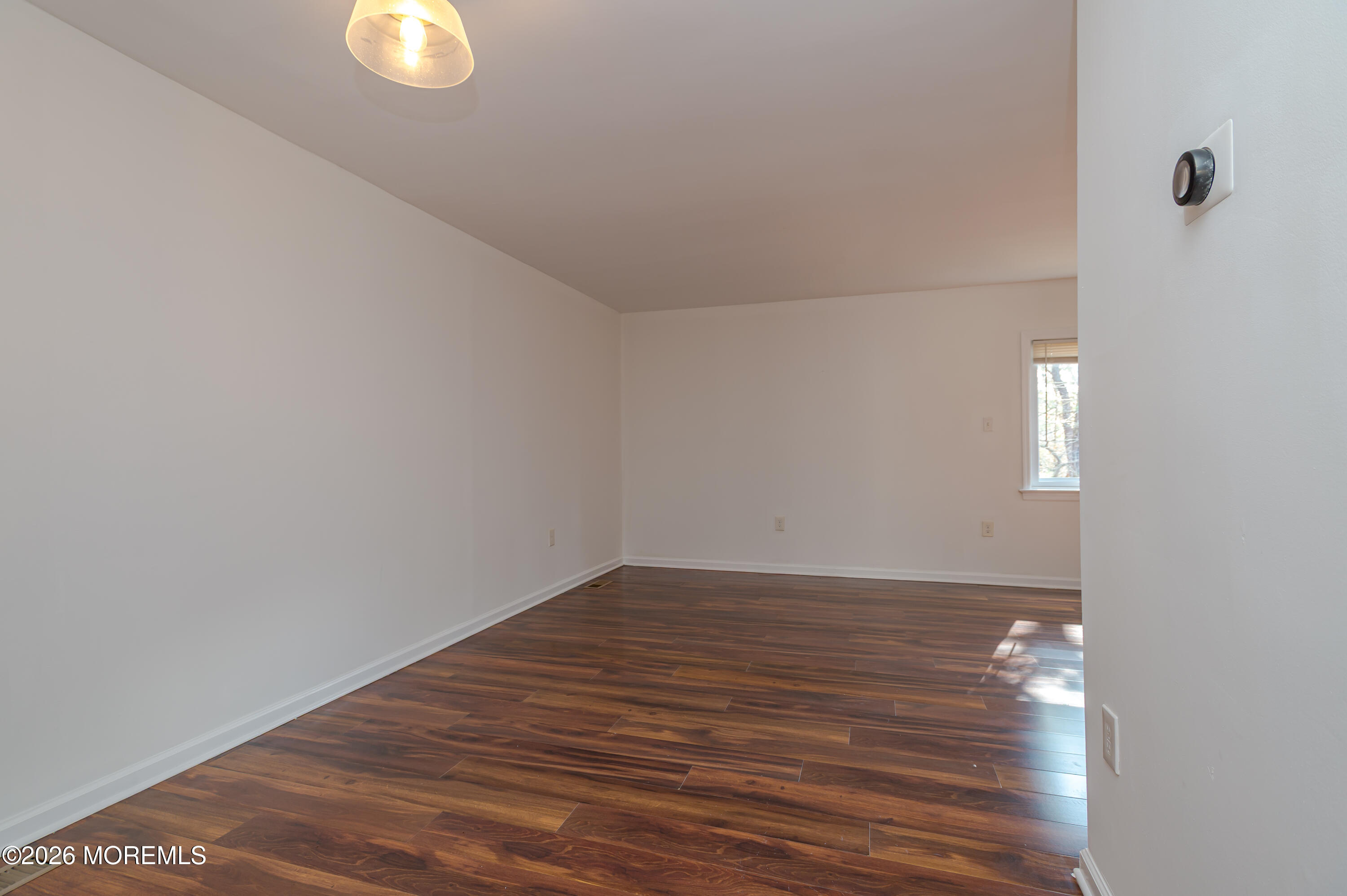 608 Alpine Trail Neptune Township, NJ 07753 - Photo 9 of 27 a view of empty room with wooden floor