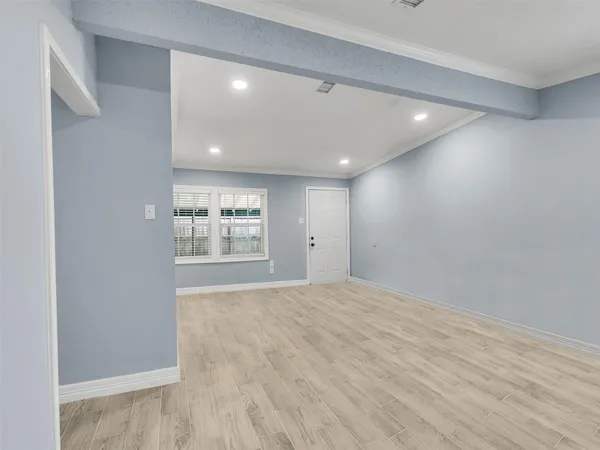 a view of an empty room with a window