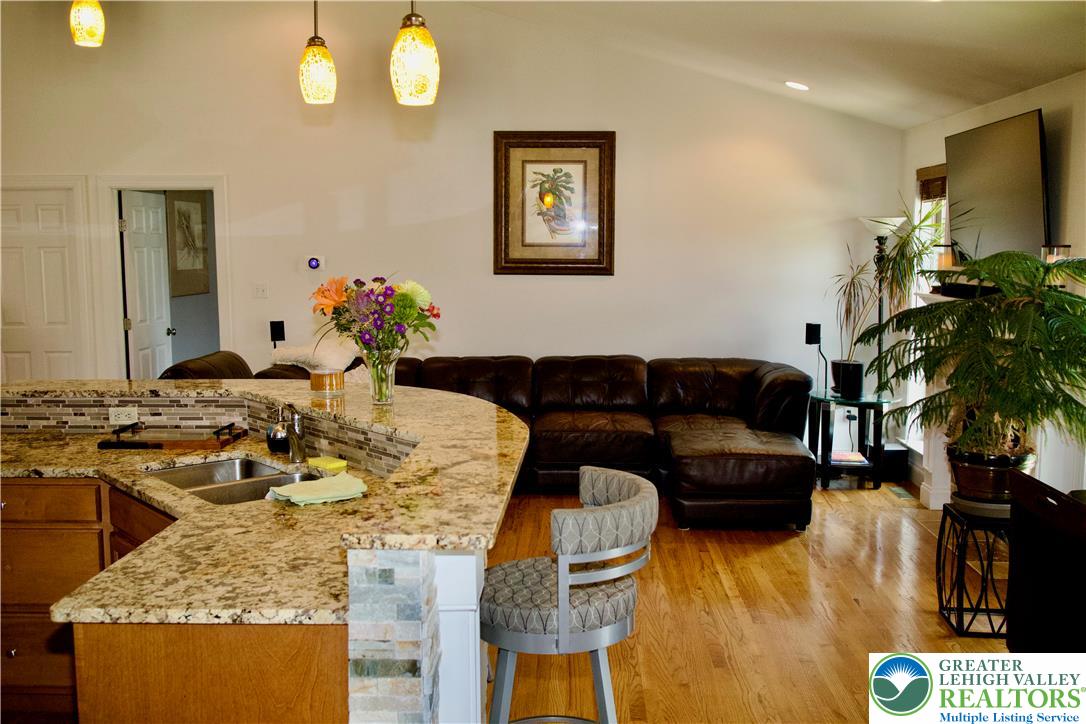 101 Cider Mill Road Mertztown, PA 19539 - Photo 17 of 26 a living room with furniture and a chandelier