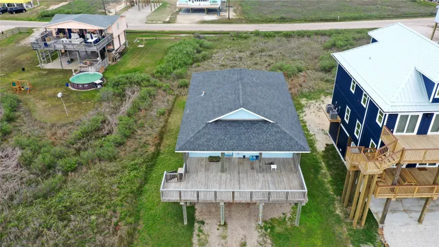 an aerial view of residential houses with outdoor space