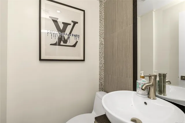 a bathroom with a toilet and sink