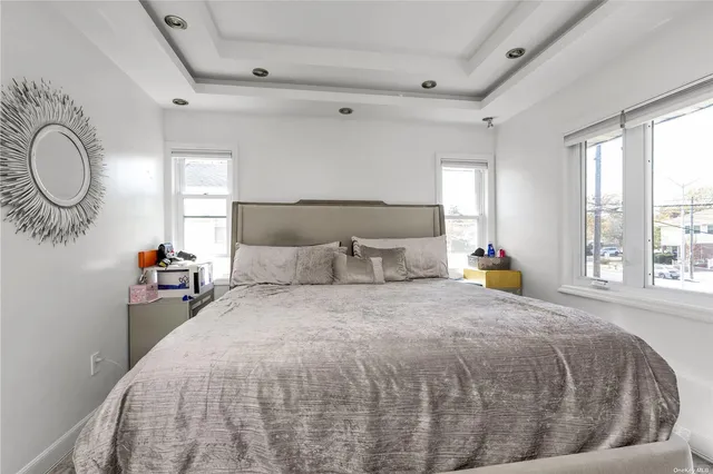 a bed room with a bed and a window