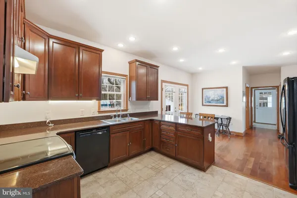 a large kitchen with lots of counter space and a sink