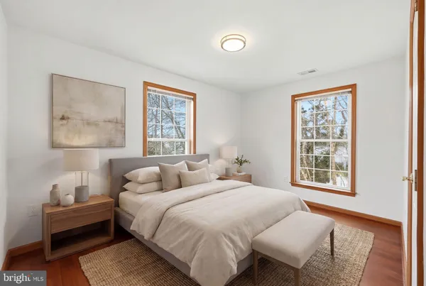 a bedroom with bed and a window