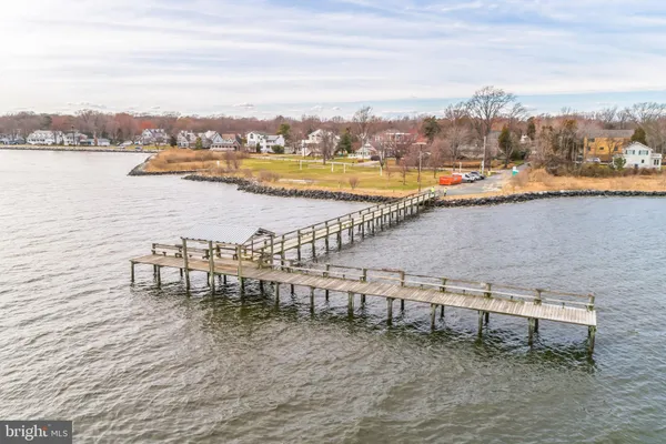 a view of a yard with snow on the road