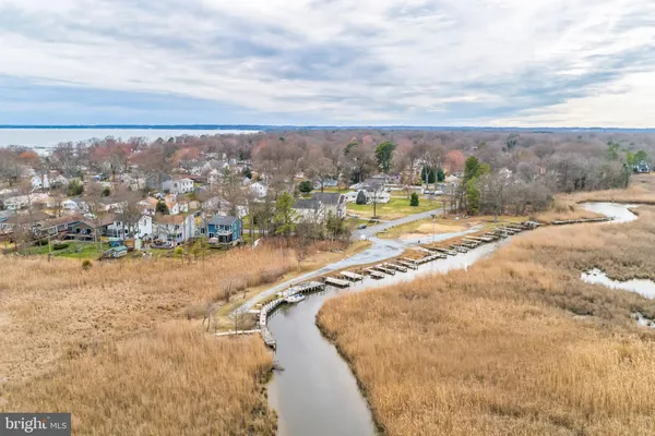a view of a yard with snow on the road