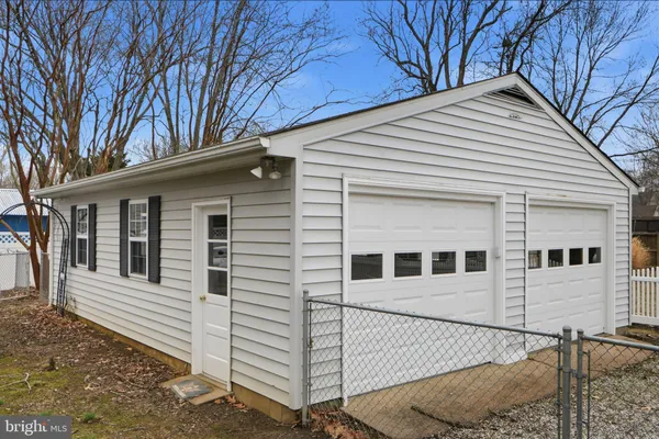 a view of a white house with a large windows