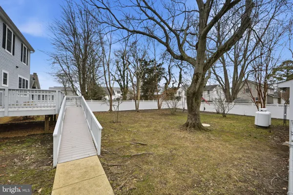 a view of spacious yard with tree
