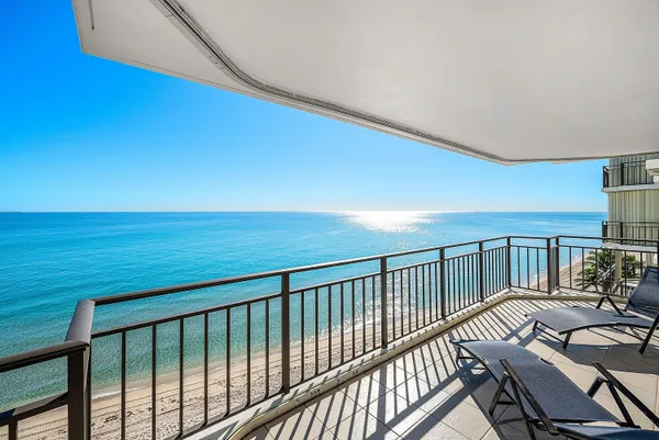 a view of balcony with furniture