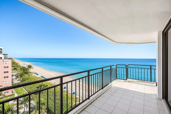 a view of balcony with wooden floor