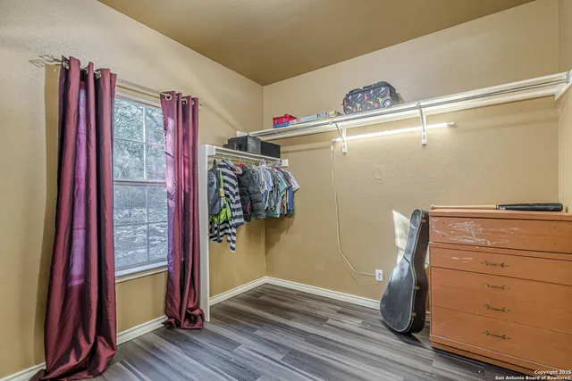 a bathroom with a tub and shower