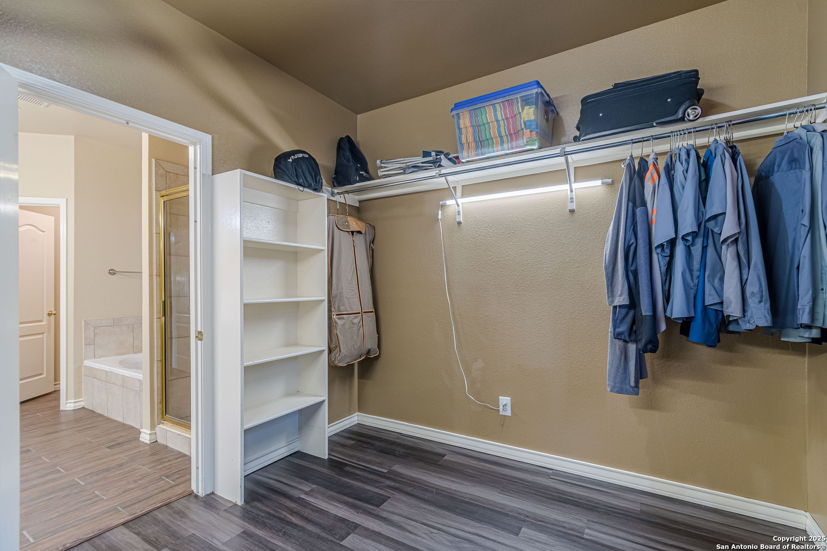 249 Lakeridge Loop Lakehills, TX 78063 - Photo 20 of 50 a view of walk in closet with clothes and shoes