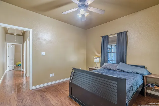 a bedroom with a bed and a chair