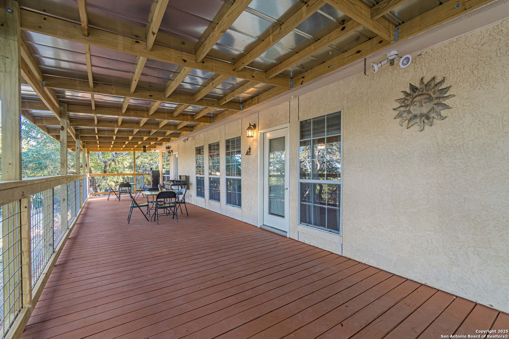 249 Lakeridge Loop Lakehills, TX 78063 - Photo 35 of 50 a view of a porch with wooden floor